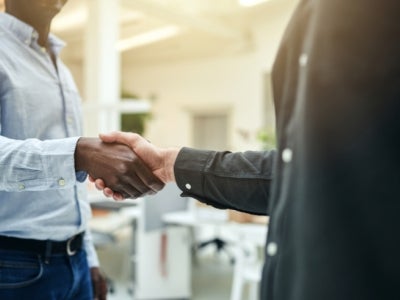 Two people shaking hands